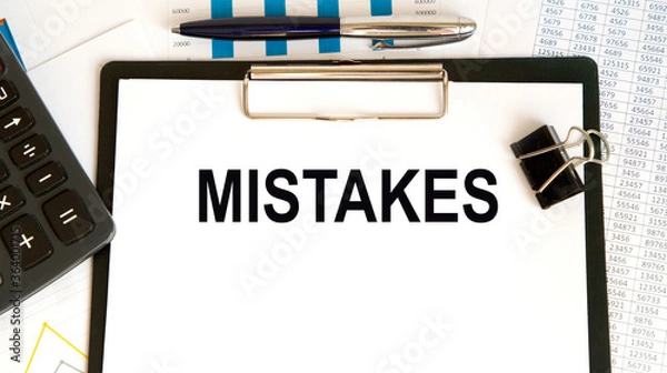 Fototapeta Wooden tablet with blank pages, crumpled paper balls and pencils on a white wooden background, creative writing concept. Minimalist writer workplace. High key still life with copy space.