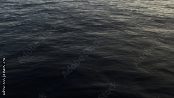 Obraz Photo of the water at sea at sunset. Dark deep water.