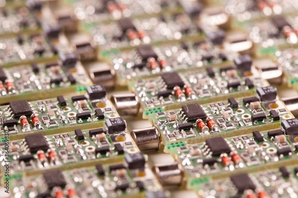 Fototapeta Closeup small microcircuits lie next to each other