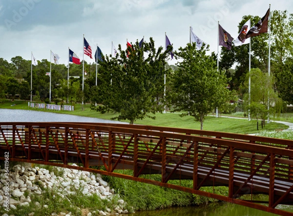 Fototapeta pedestrian bridge to Historic Flag Park in Conroe, TX