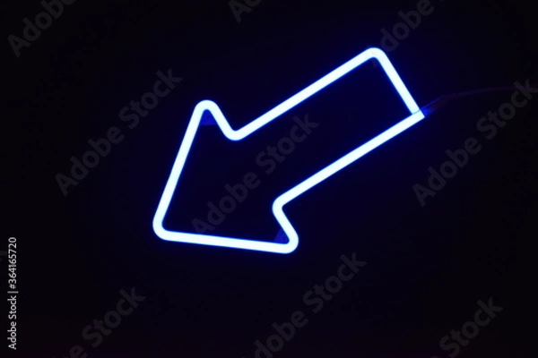 Obraz A blue LED arrow with a black background