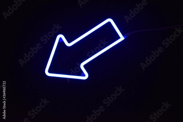Obraz A blue LED arrow with a black background
