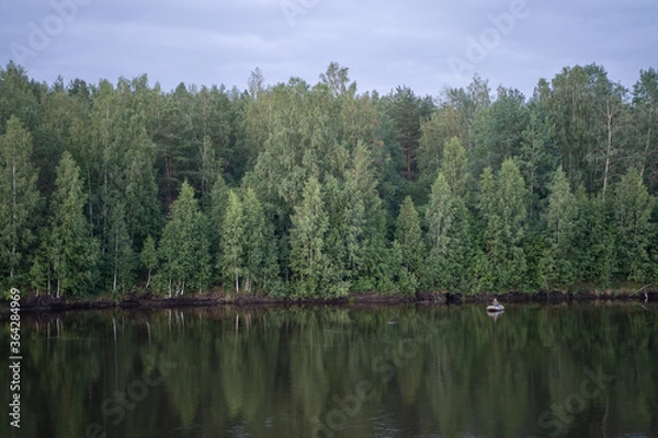 Obraz Trees are reflected in the water. Boat view