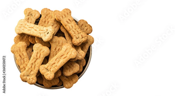 Obraz Pile of Bone shaped dog biscuits in food bowl. White background with copy space
