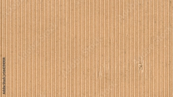 Obraz Tekstura tektury falistej. Pusty pusty karton z pojedynczym rozdartym otworem. Tło materiału z recyklingu.