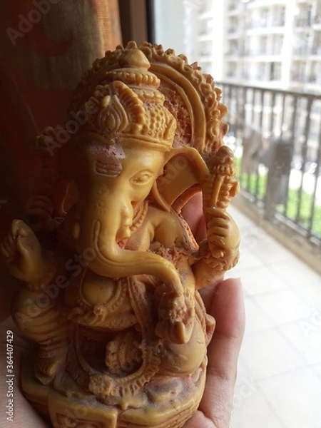 Fototapeta lord ganesha small statue at home