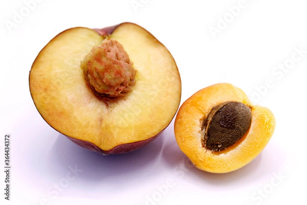 Fototapeta Peach and apricot sliced closeup on a white background