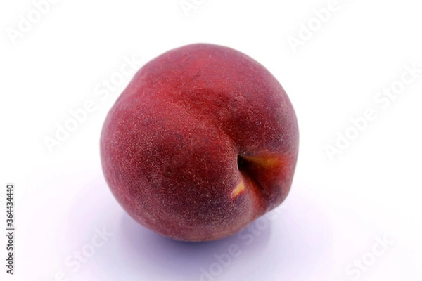 Fototapeta Ripe red peach close-up isolated on a white background.