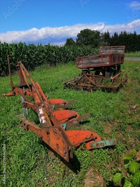 Obraz old rusty farmers field-instruments