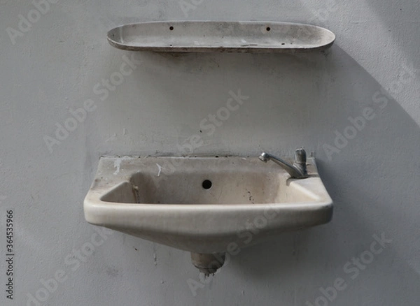 Obraz Old washbasin that is broken doesn't work.