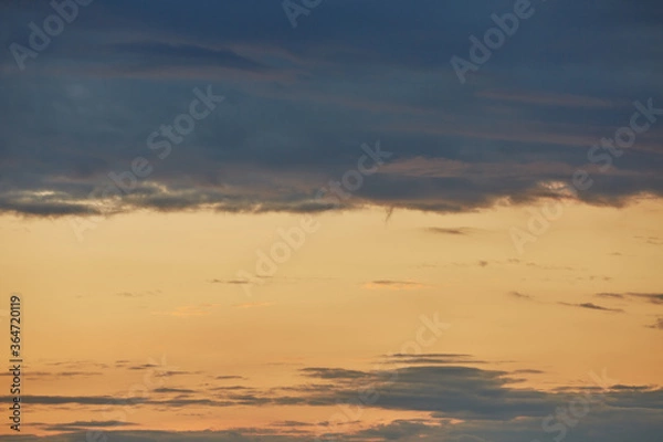 Fototapeta Cloudy sunset on a summer evening