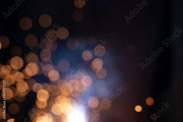 Fototapeta Gold abstract bokeh background, Festive xmas abstract background with bokeh defocused lights and stars