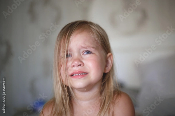 Obraz portrait of a beautiful little crying girl