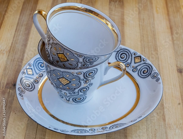 Obraz striking Chinese porcelain Cup with saucer on a wooden background