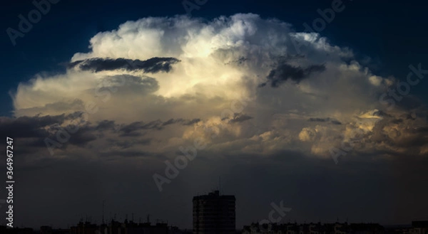 Fototapeta clouds over the city