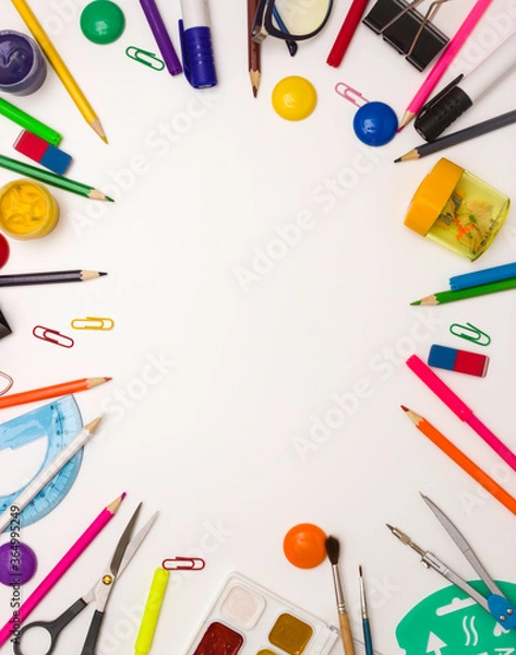 Fototapeta Education, office, and object concept. Stationery frame on a white background. Free space for text, top view.