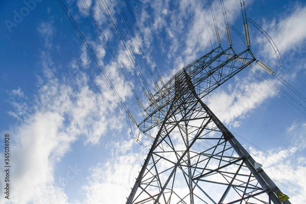 Fototapeta High voltage pylons with the sky in the background