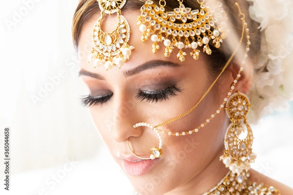 Obraz Beautiful Sikh bride wearing traditional wedding attire and jewelry