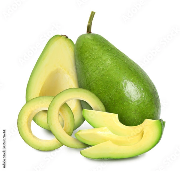 Fototapeta Cut and whole fresh avocados on white background