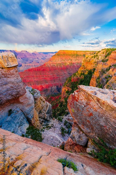 Fototapeta Panoramic image of the colorful Sunset on the Grand Canyon in Grand Canyon National Park from the south rim part,Arizona,USA, on a sunny cloudy day with blue or gloden sky