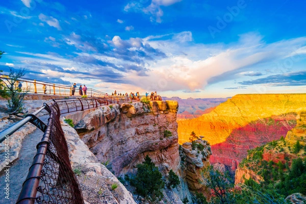 Fototapeta Panoramic image of the colorful Sunset on the Grand Canyon in Grand Canyon National Park from the south rim part,Arizona,USA, on a sunny cloudy day with blue or gloden sky