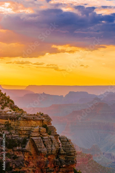 Fototapeta Panoramic image of the colorful Sunset on the Grand Canyon in Grand Canyon National Park from the south rim part,Arizona,USA, on a sunny cloudy day with blue or gloden sky