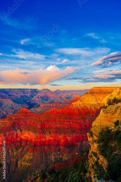 Fototapeta Panoramic image of the colorful Sunset on the Grand Canyon in Grand Canyon National Park from the south rim part,Arizona,USA, on a sunny cloudy day with blue or gloden sky