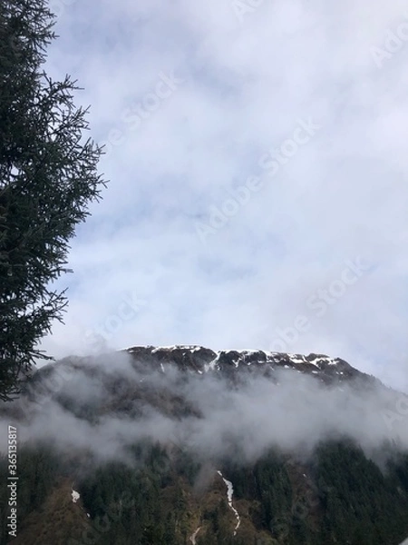 Fototapeta clouds in the mountains