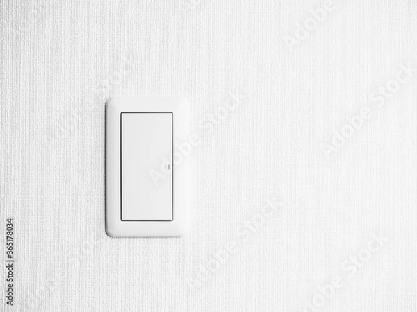 Fototapeta 白い壁にある照明のスイッチ