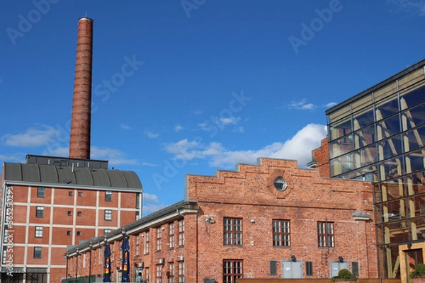 Obraz  red brick factory building with a tall chimney in Lahti. Finland.