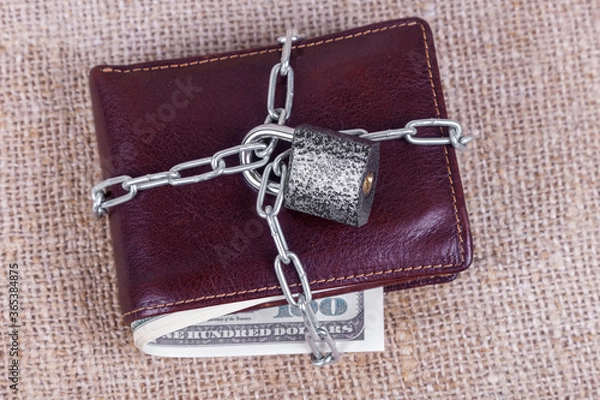 Fototapeta wallet with money in chains
