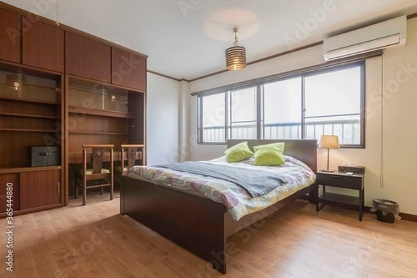 Obraz King size bed in a bright and spacious bedroom