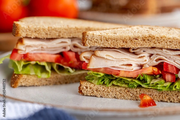 Fototapeta Turkey Sandwich With Tomato and Lettuce