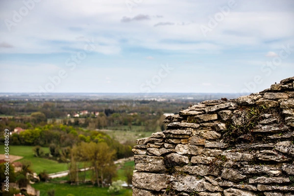 Obraz view from the top of the hill with a rock wall 