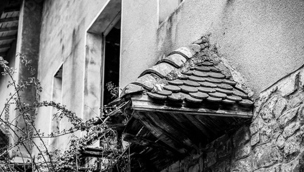 Obraz small broken roof of a old house in the coutnryside
