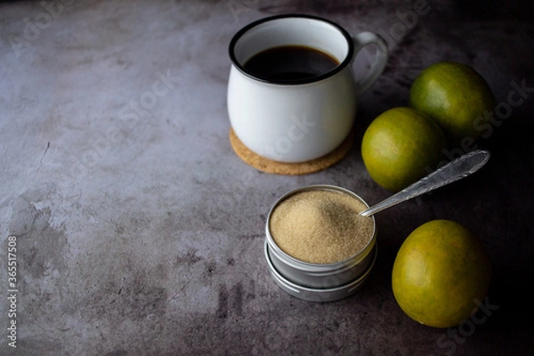 Obraz dried monk fruit, luo han guo, and monk fruit sugar crystals accompanied with a cup of tea or coffee