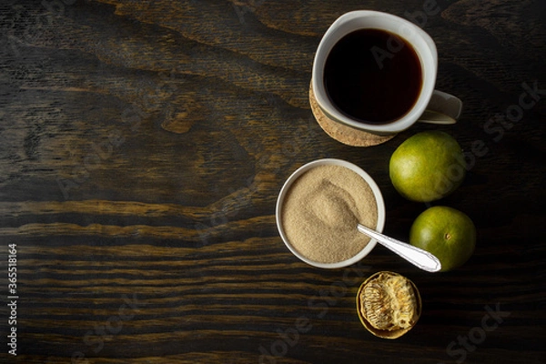 Obraz dried monk fruit, luo han guo, and monk fruit sugar crystals accompanied with a cup of tea or coffee