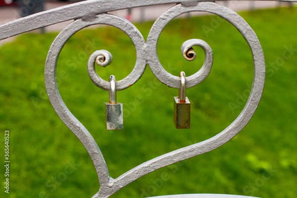 Obraz Two locks on heart shaped metal structure
