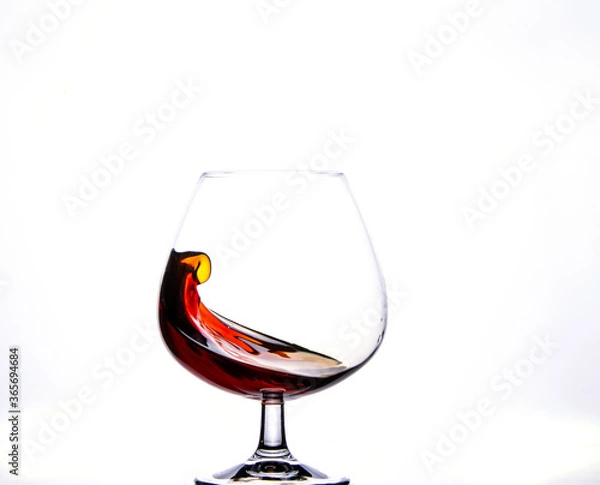 Fototapeta Crystal Glass with Splash of Brandy.
