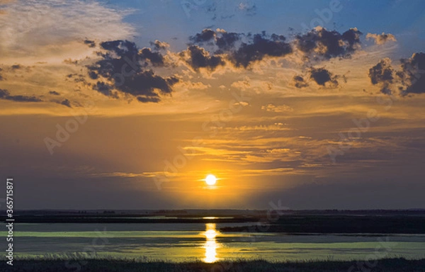 Fototapeta sunset over the river
