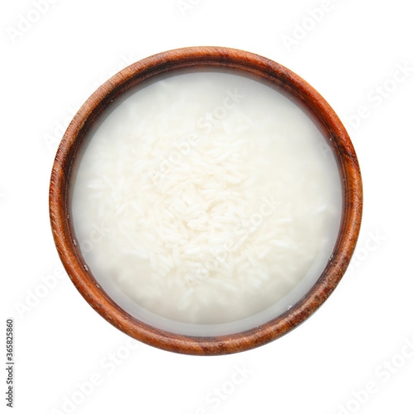 Fototapeta Bowl with rice and water on white background
