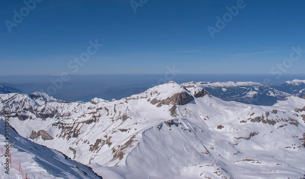 Fototapeta Beautiful panoramic view of snow-capped mountains in the Swiss Alps.
