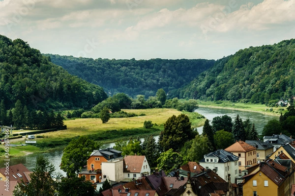 Fototapeta Village on an river in the mountains in Germany