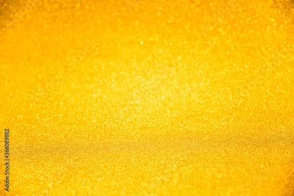 Fototapeta Luxury gold glitter texture with bokeh as background, de-focused. concept for studio backdrop , chrismas , holiday , happy new year , decoration.