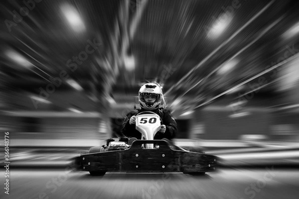 Fototapeta The man is in the go-kart on the karting track