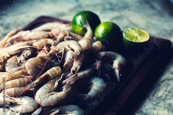 Obraz Raws prawns in a cutting board ready to cook