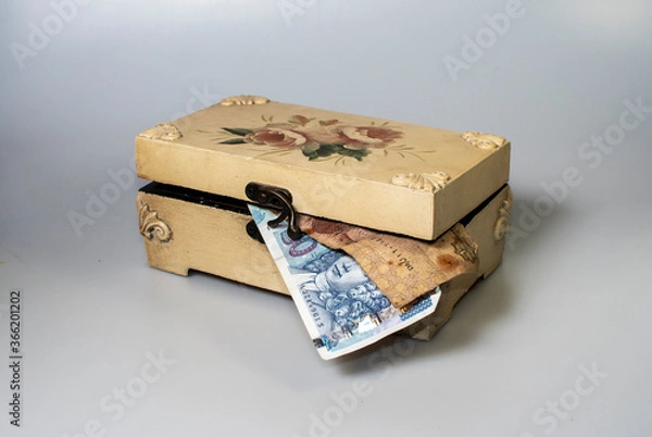 Obraz small carved box with old coins