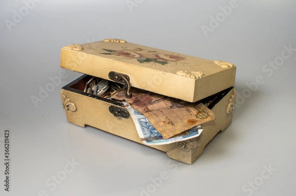 Obraz small carved box with old coins