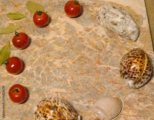 Fototapeta presentation surface - vegetables, seashells, egg on marble surface: cherry tomatoes, bay leaves, oyster, seashells, chicken egg