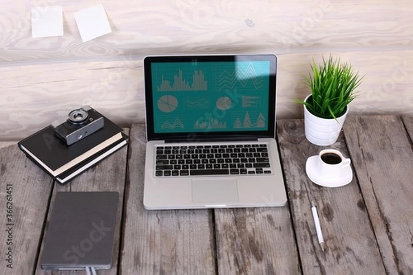 Obraz Stylish workspace with computer and posters on home or studio.